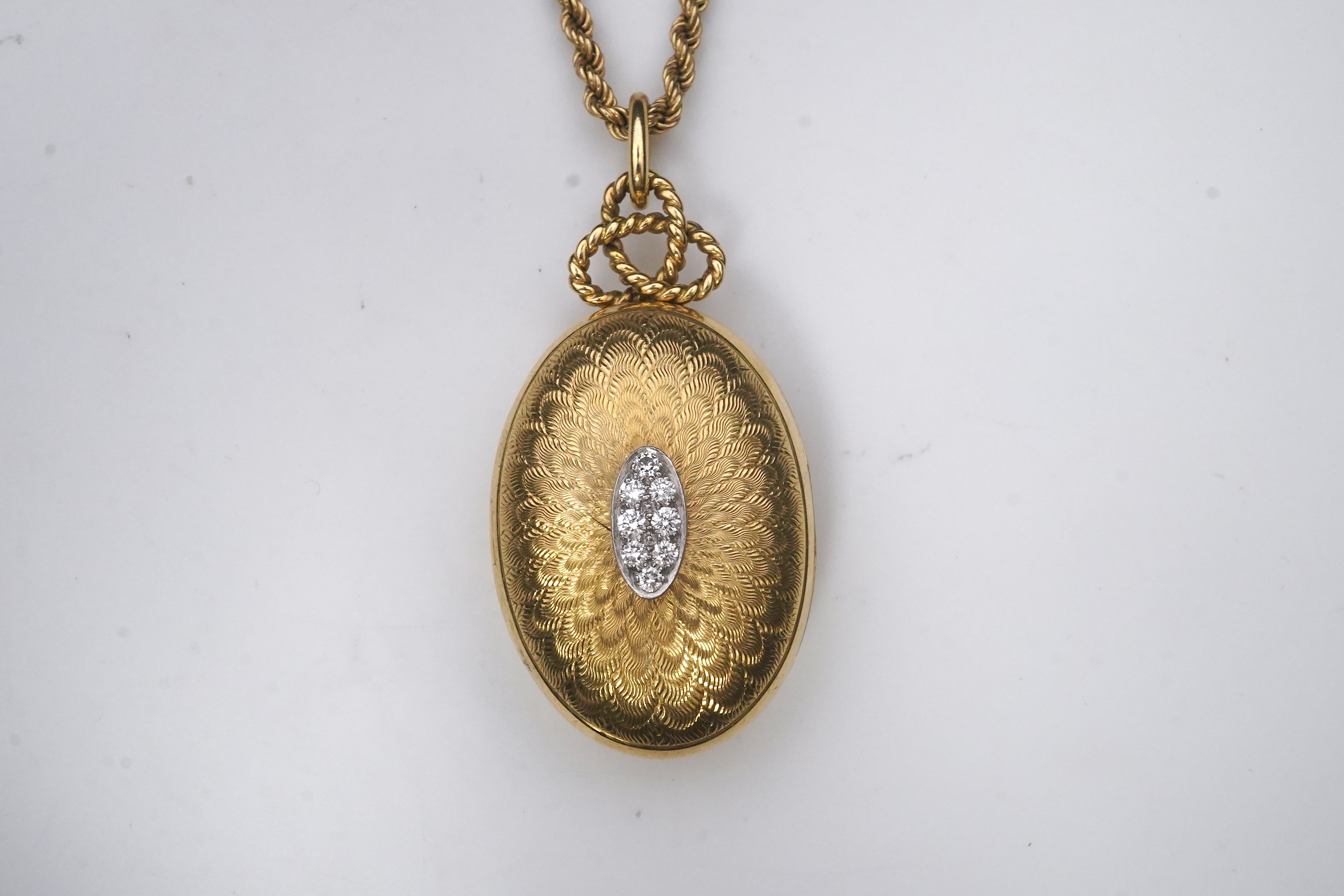 Cartier, an 18ct gold and diamond locket pendant, 1978